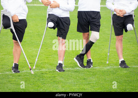 close-up of ampute soccer player and team friends Stock Photo