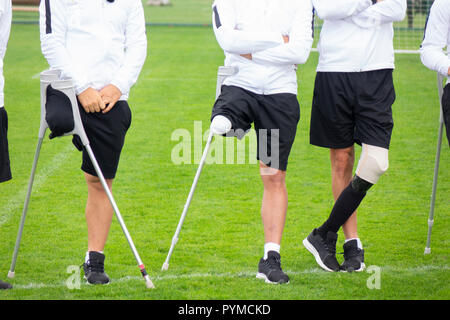 close-up of ampute soccer player and team friends Stock Photo