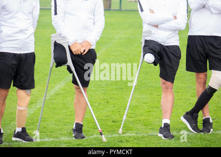 close-up of ampute soccer player and team friends Stock Photo