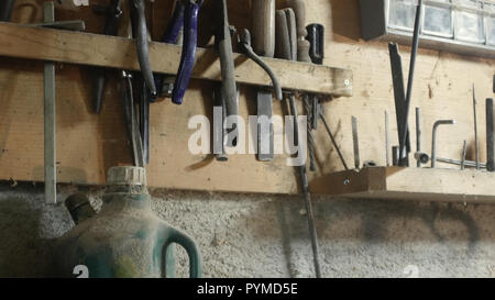 tracking shot on a wall full of carpenter's tools Stock Photo