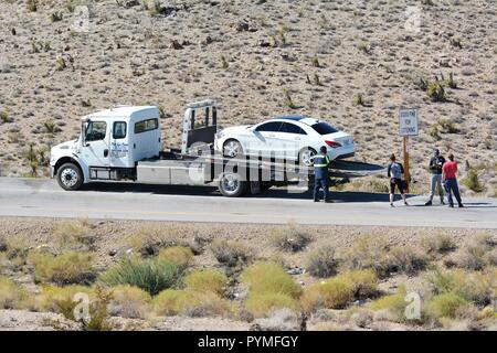 Stranded car on Freeway in California Desert Stock Photo