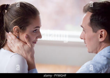 Couple looking at each other with love and tender Stock Photo