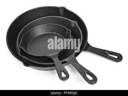 Cast iron pans with empty space, isolated on white background. Cut out objects with top view or high angle view and copy space. Stock Photo