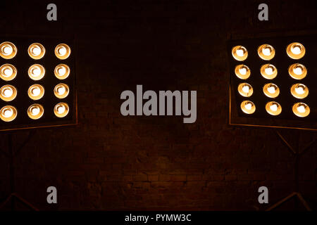 Dark background with spotlights. Brick wall. Copy space Stock Photo