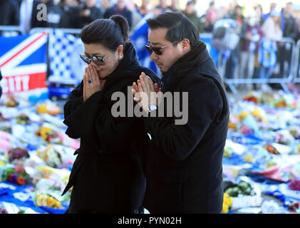 Aiyawatt Srivaddhanaprabha son of Leicester Chairman lays a wreath in memory of his father with his mother Aimon. Vichai Srivaddhanaprabha, was among those to have tragically lost their lives on Saturday evening when a helicopter carrying him and four other people crashed outside King Power Stadium. Stock Photo