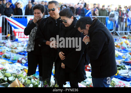 Aiyawatt Srivaddhanaprabha son of Leicester Chairman lays a wreath in memory of his father with his mother Aimon (second right). Vichai Srivaddhanaprabha, was among those to have tragically lost their lives on Saturday evening when a helicopter carrying him and four other people crashed outside King Power Stadium. Stock Photo