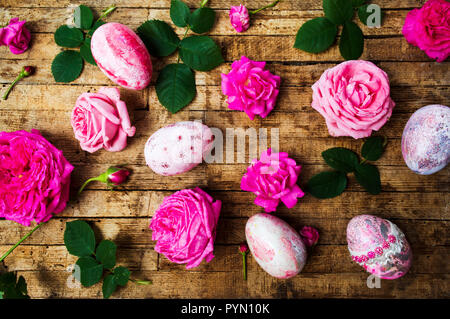 Easter eggs with fresh roses festive arrangement Stock Photo