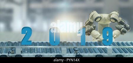 2019 year artificial intelligence or ai futuristic concept,  assistant robot try to put number of new year coming 2019 on operation line, industry 4.0 Stock Photo
