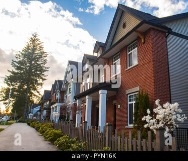 Row of Typical English Terraced Houses. Red brick homes side by side. Stock Photo