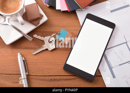 Smartphone in an architect's office. Concept of the technological use in the construction and interior design. Top view. Stock Photo