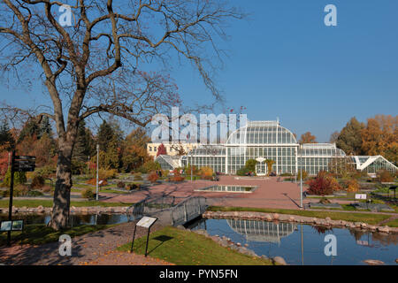 Helsinki, Finland - October 14, 2018: People walking and resting in Kaisaniemi botanic garden in front of Palm house. It was built in 1889 by design o Stock Photo