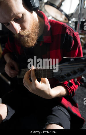 Bearded Man Playing Guitar Stock Photo