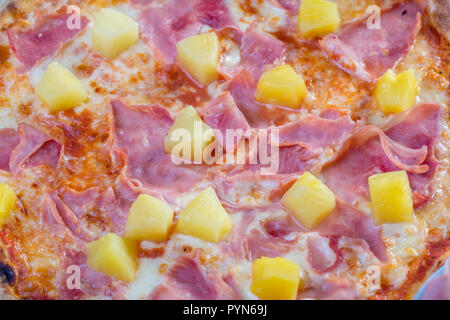 close up of tasty hawaian ham and apple pizza with ingredients Stock Photo