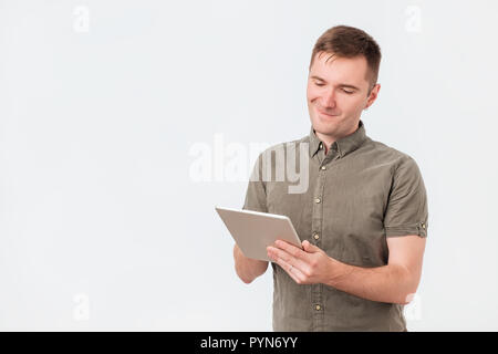 Handsome man using tablet on white background Stock Photo