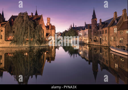 View of beautiful medieval buildings at Rozenhoedkaai photographed at twilight, Bruges (Brugge), West Flanders, Belgium. Stock Photo