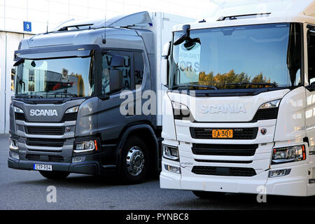 Lieto, Finland - October 19, 2018: Scania P delivery trucks, white P250 diesel and grey P280 CNG/CGB gas powered on Scania Urban Tour 2018 Turku. Stock Photo