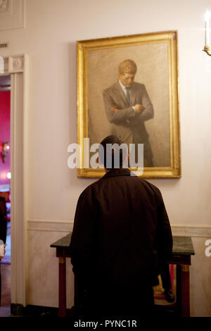 On a tour of the State Floor of the White House, President Barack Obama looks at a portrait of John F. Kennedy by Aaron Shikler. 1/24/09 Stock Photo