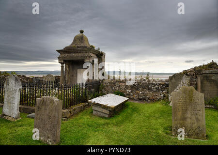 Clouds over cemetery at The Parish Church of Saint Mary the Virgin on tidal Island of Holy Island of Lindisfarne England UK Stock Photo