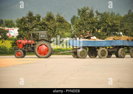 09/08/18, Hamhung, North-Korea: a North Korean propaganda planned economy site with a tractor arriving on site to show prosperity and advanced technol Stock Photo
