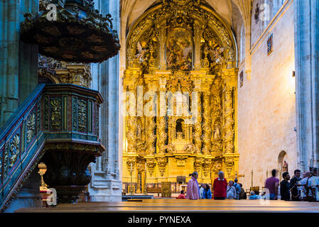 Main reredos of the monastery church, created in 1692 by Jose de Churriguera. Convento de San Esteban is a Dominican monastery situated in the Plaza d Stock Photo