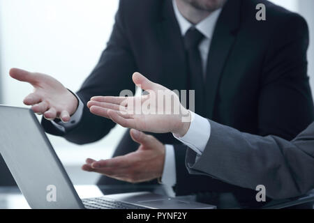close up. business partners discussing online information Stock Photo