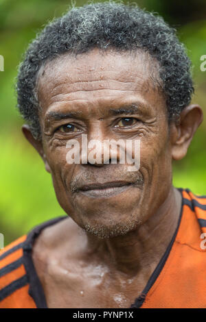 TUNGU VILLAGE, ARU ISLANDS, INDONESIA, DECEMBER 06, 2017 : Portrait of a jungle hunter near the Tungu village in Aru islands, Papua, Indonesia. Stock Photo
