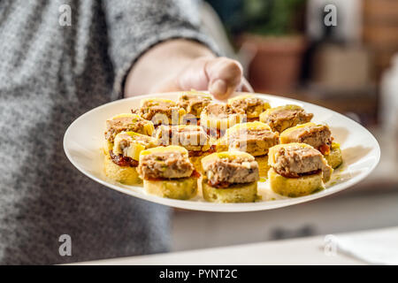 Mini sandwiches with onion chutney and pulled duck meat Stock Photo
