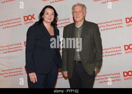 Leipzig, Germany. 29th Oct, 2018. Festival director Leena Pasanen and German director Werner Herzog in the CineStar cinema on the occasion of the opening of the 61st documentary film festival DOK Leipzig. The motto of the event will be 'Demand the impossible!' and 306 films from 50 countries will be shown from 29 October to 04 November 2018. Credit: Sebastian Kahnert/dpa-Zentralbild/dpa/Alamy Live News Stock Photo