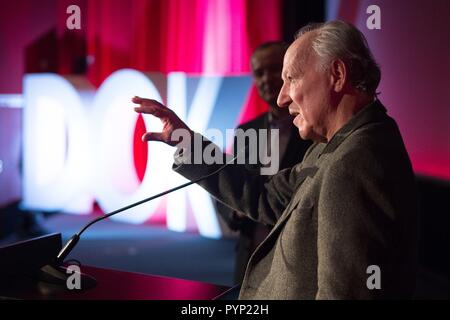 Leipzig, Germany. 29th Oct, 2018. German director Werner Herzog speaking to guests at the CineStar cinema on the occasion of the opening of the 61st documentary film festival DOK Leipzig. The motto of the event will be 'Demand the impossible!' and 306 films from 50 countries will be show from 29 October to 04 November 2018. Credit: Sebastian Kahnert/dpa-Zentralbild/dpa/Alamy Live News Stock Photo