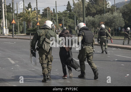 Athens, Greece. 1st Jan, 2006. A student seen being arrested by a police officer during the protest.Hundreds of students protested against the New Lyceum and said they were determined to claim ''the school and the life they deserve''. Students argue that the changes promoted by the Education Ministry deprive them of the right to education. Credit: Nikolas Joao Kokovlis/SOPA Images/ZUMA Wire/Alamy Live News Stock Photo