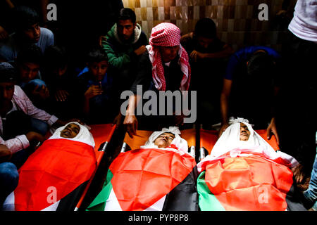 October 29, 2018 - The funeral of three boys killed last night by an Israeli airstrike close to the fence dividing Gaza and Israel takes place in the Al-Hikma mosque in the Deir Al-Balah city, in the central Gaza strip on 29 October 2018. The head of Hamas political bureau, Ismail Haniyeh, the senior member of the political bureau of the Islamic Jihad, Khaled al-Batsh, and the deputy speaker of the Palestinian Legislative Council, Ahmed Bahr, attended the ceremony at the mosque. Khaled Bassam Mahmoud Abu Saeed, 14, Abdul Hameed Mohammed Abdul Aziz Abu Zaher, 13, and Mohammed Ibrahim Abdullah A Stock Photo