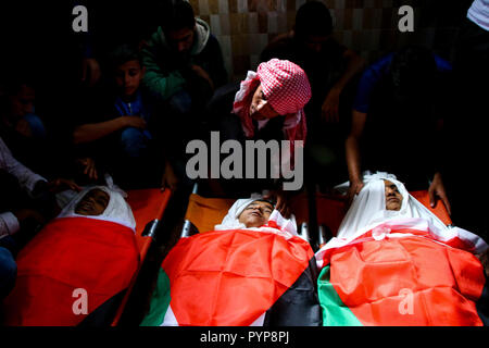 October 29, 2018 - The funeral of three boys killed last night by an Israeli airstrike close to the fence dividing Gaza and Israel takes place in the Al-Hikma mosque in the Deir Al-Balah city, in the central Gaza strip on 29 October 2018. The head of Hamas political bureau, Ismail Haniyeh, the senior member of the political bureau of the Islamic Jihad, Khaled al-Batsh, and the deputy speaker of the Palestinian Legislative Council, Ahmed Bahr, attended the ceremony at the mosque. Khaled Bassam Mahmoud Abu Saeed, 14, Abdul Hameed Mohammed Abdul Aziz Abu Zaher, 13, and Mohammed Ibrahim Abdullah A Stock Photo