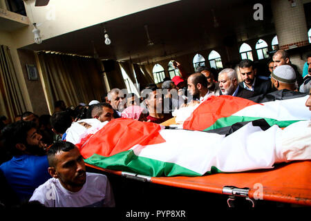 October 29, 2018 - The funeral of three boys killed last night by an Israeli airstrike close to the fence dividing Gaza and Israel takes place in the Al-Hikma mosque in the Deir Al-Balah city, in the central Gaza strip on 29 October 2018. The head of Hamas political bureau, Ismail Haniyeh, the senior member of the political bureau of the Islamic Jihad, Khaled al-Batsh, and the deputy speaker of the Palestinian Legislative Council, Ahmed Bahr, attended the ceremony at the mosque. Khaled Bassam Mahmoud Abu Saeed, 14, Abdul Hameed Mohammed Abdul Aziz Abu Zaher, 13, and Mohammed Ibrahim Abdullah A Stock Photo