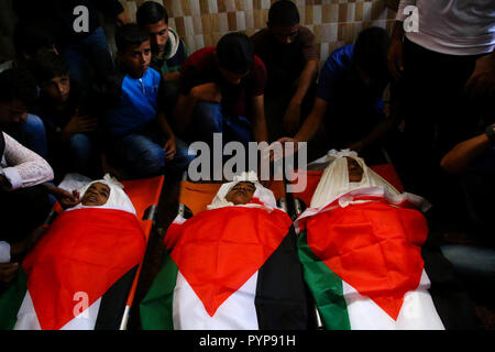 October 29, 2018 - The funeral of three boys killed last night by an Israeli airstrike close to the fence dividing Gaza and Israel takes place in the Al-Hikma mosque in the Deir Al-Balah city, in the central Gaza strip on 29 October 2018. The head of Hamas political bureau, Ismail Haniyeh, the senior member of the political bureau of the Islamic Jihad, Khaled al-Batsh, and the deputy speaker of the Palestinian Legislative Council, Ahmed Bahr, attended the ceremony at the mosque. Khaled Bassam Mahmoud Abu Saeed, 14, Abdul Hameed Mohammed Abdul Aziz Abu Zaher, 13, and Mohammed Ibrahim Abdullah A Stock Photo