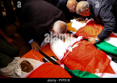 October 29, 2018 - The funeral of three boys killed last night by an Israeli airstrike close to the fence dividing Gaza and Israel takes place in the Al-Hikma mosque in the Deir Al-Balah city, in the central Gaza strip on 29 October 2018. The head of Hamas political bureau, Ismail Haniyeh, the senior member of the political bureau of the Islamic Jihad, Khaled al-Batsh, and the deputy speaker of the Palestinian Legislative Council, Ahmed Bahr, attended the ceremony at the mosque. Khaled Bassam Mahmoud Abu Saeed, 14, Abdul Hameed Mohammed Abdul Aziz Abu Zaher, 13, and Mohammed Ibrahim Abdullah A Stock Photo