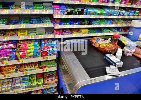 Candy, sweets to temp customers at supermarket checkout Stock Photo - Alamy