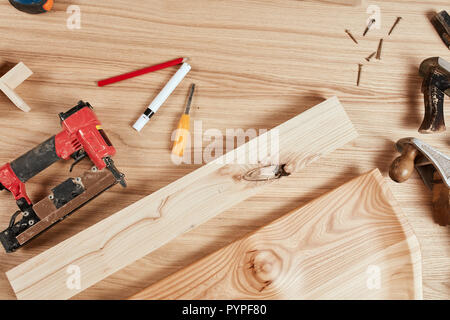 Set of carpenter s tools on wooden background, flat ray Stock Photo