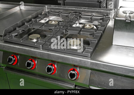 Professional kitchen stove with four gas burners Stock Photo