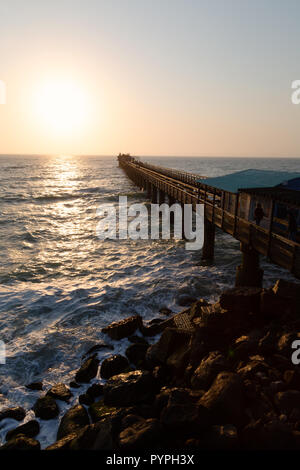Namibia sunset - the jetty at sunset, on the atlantic coast at Swakopmund Namibia Africa Stock Photo