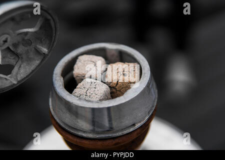 Close-up of a top of hookah with coconut coal. Stock Photo