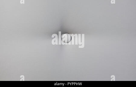 Creamy leather sofa background with buttons as a texture. Stock Photo