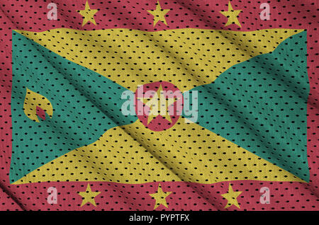 Grenada flag printed on a polyester nylon sportswear mesh fabric with some folds Stock Photo
