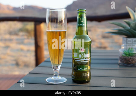 Namibia beer - Windhoek lager bottle and glass, in Namibia Africa Stock Photo