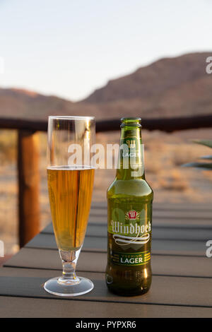 Namibia beer - Windhoek lager bottle and glass, in Namibia Africa Stock Photo