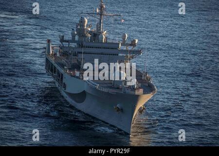 181028-N-KA046-0489    NORWEGIAN SEA (Oct. 28, 2018) – The Blue Ridge-class command and control ship USS Mount Whitney (LCC 20) transits the Norwegian Sea during the NATO  Exercise Trident Juncture 18, Oct. 28, 2018. Mount Whitney, forward-deployed to Gaeta, Italy, operates with a combined crew of U.S. Navy Sailors and Military Sealift Command civil service mariners. (U.S. Navy photo by Mass Communication Specialist 2nd Class James R. Turner/Released) Stock Photo