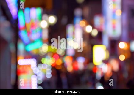 Neon city night - Shinjuku ward, Tokyo. Defocused blurred city lights. Stock Photo