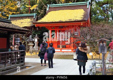 KYOTO, JAPAN - NOVEMBER 25, 2016: People visit Kitano Tenmangu shrine in Kyoto, Japan. 19.7 million foreign tourists visited Japan in 2015. Stock Photo