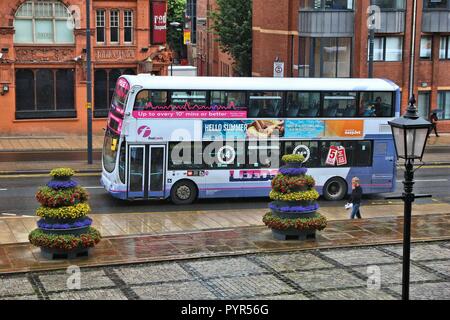 LEEDS, UK - JULY 11, 2016: People ride FirstLeeds double decker bus in Leeds, UK. FirstGroup employs 124,000 people. Stock Photo