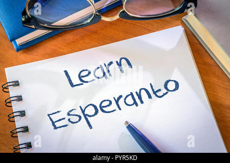 Learn Esperanto written in a notepad. Education concept Stock Photo