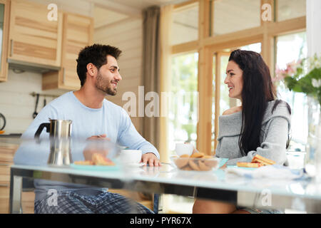 Happy couple having breakfast together Stock Photo